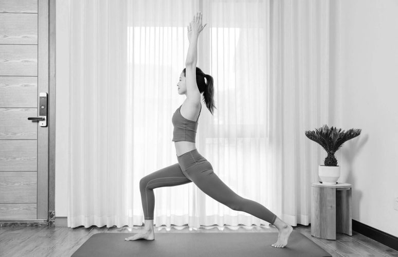 young-asian-woman-doing-yoga-indoors-bw-B74DXYY.jpg